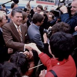 Ronald Reagan greeting a crowd and the press C 1980
