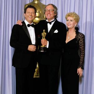 John Barry Debbie Reynolds and Donald OConnor at event of The 58th Annual Academy Awards 1986