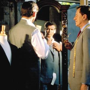 Tailor Harry Pendel Geoffrey Rush right may be known for his fine suits but British spy Andrew Osnard Pierce Brosnan has more than haberdashery to discuss with the excon