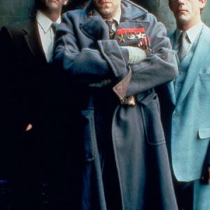 Emilio Lizardo, flanked by John O'Connor (left) and John Bigboote (right)