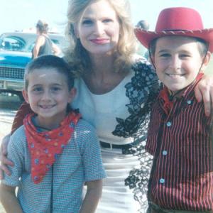 (l to r) Marc Musso, Kyra Sedgwick, and Mitchel Musso on the set of 