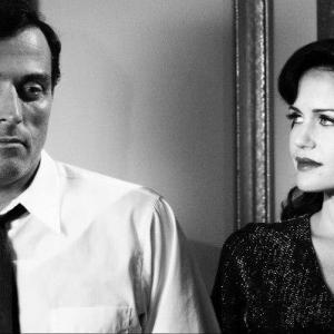 Still of Carla Gugino and Rufus Sewell in Hotel Noir 2012