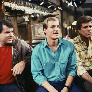 Still of Woody Harrelson Ted Danson and Robert Urich in Cheers 1982
