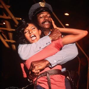 Still of Pam Grier and Carl Weathers in Friday Foster 1975