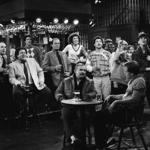 Still of Woody Harrelson, Ted Danson, Kelsey Grammer, John Ratzenberger, George Wendt, Johnny Gilbert and Rhea Perlman in Cheers (1982)