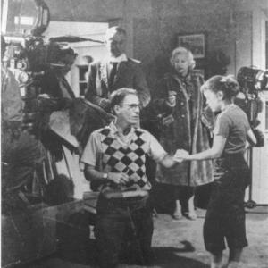 Hair stylist Dotha Hippe looks on during a filming of Father Knows Best