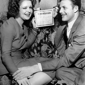 Clara Bow with husband Rex Bell holding their marriage certificate 1931 IV