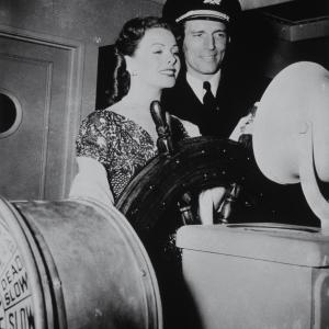 Still of Jeanne Crain and Michael Rennie in Dangerous Crossing 1953