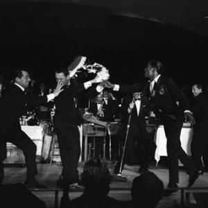 Peter Lawford Dean Martin Joey Bishop Frank Sinatra Sammy Davis Jr and Buddy Lester performing in the Copa Room at the Sands Hotel in Las Vegas