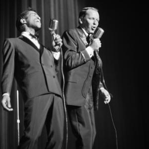 Frank Sinatra and Sammy Davis Jr performing at a Share Party circa 1963