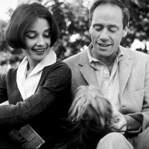 Audrey Hepburn and Mel Ferrer with their pet dog Famous outside their home in Los Angeles CA 1957