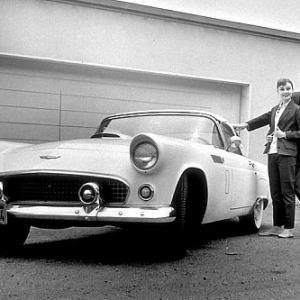 332258 Audrey Hepburn and Mel Ferrer with their 1956 TBird at home in Beverly Hills