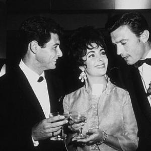 Eddie Fisher, Elizabeth Taylor and Laurence Harvey at a party thrown by Eddie Fisher at the Coconut Grove C. 1960