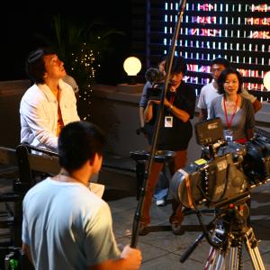 Jackie Chan on set for a safe sex/condom PSA, directed by Ruby Yang and Thomas Lennon.