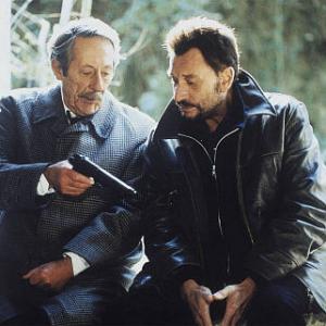 Still of Johnny Hallyday and Jean Rochefort in L'homme du train (2002)