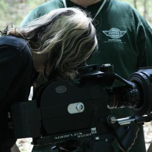 Cinematographer looks on as J.A Steel checks the shot on the Arri Super 16mm Camera for DENIZEN.