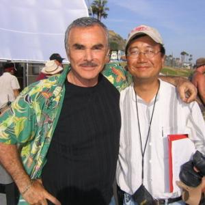 Burt Reynolds and Michael Goi, ASC on the set of the comedy 