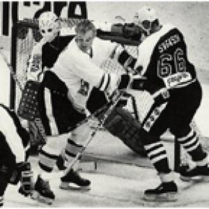 Bo Svenson holding off Bobby Orr in NHL Celebrity All-Stars vs. Boston Bruin Legends at Boston Garden in 1989