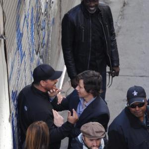 On the set of Rupert Wyatts The Gambler Mark Wahlberg and Second Unit Director Ben Bray having a laugh with Michael Kenneth Williams as they walk through an action sequence