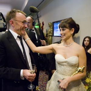 Oscar® winners Danny Boyle (left) and Penelope Cruz backstage during the live ABC Telecast of the 81st Annual Academy Awards® from the Kodak Theatre, in Hollywood, CA Sunday, February 22, 2009.