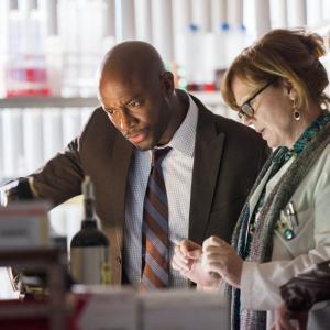Still of Taye Diggs and Kathleen Robertson in Murder in the First 2014