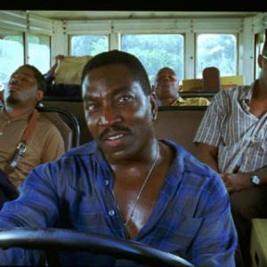 JAMIE FOXX as American legend Ray Charles far right and CLIFTON POWELL as road manager Jeff Brown driving in the musical biographical drama Ray