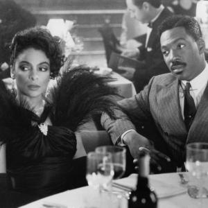 Still of Eddie Murphy and Jasmine Guy in Harlem Nights 1989