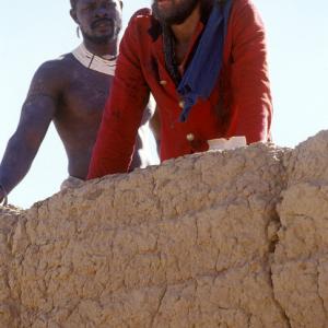 (Left to right) Djimon Hounsou as Abou Fatma and Heath Ledger as Harry