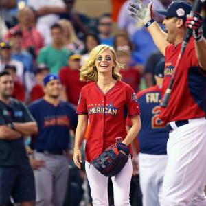 January Jones celebrates at the 2014 MLB AllStar legends and celebrity softball game on July 13 2014 at the Target Field in Minneapolis Minnesota