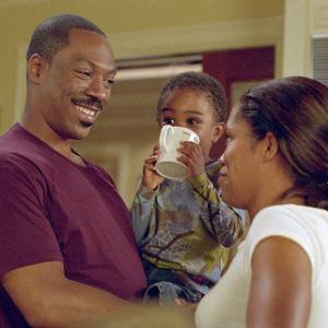 Eddie Murphy, left, plays an out of work dad who agrees to mind his son (Khamani Griffin, center), so his wife (Regina King) can return to work.