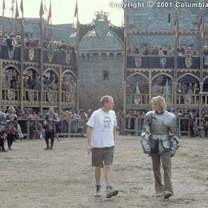 Writerdirectorproducer Brian Helgeland left and star Heath Ledger discuss a scene during the Praguebased filming