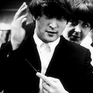 The Beatles John Lennon and Paul McCartney Backstage fixing Johns hair September 15 1964
