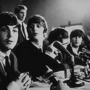 The Beatles ( Paul McCartney,Ringo Starr, George Harrison, John Lennon) at a press conference. c. 1964