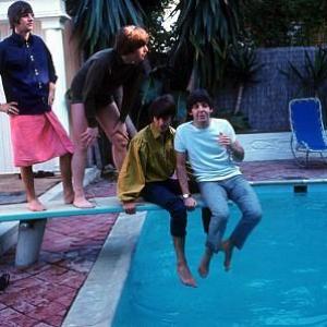 The Beatles Ringo Starr John Lennon George Harrison Paul McCartney on the diving board by the poolside