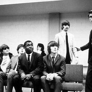 The Beatles John Lennon Paul McCartney George Harrison and Ringo Starr waiting for some instruction of some sort c1964