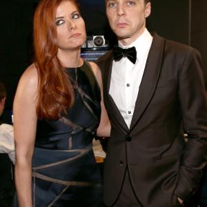Debra Messing and Jim Parsons at event of The 66th Primetime Emmy Awards (2014)