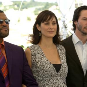 Keanu Reeves, Laurence Fishburne and Carrie-Anne Moss at event of Matrica: Perkrauta (2003)