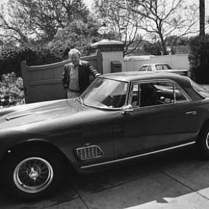 Carroll O'Connor and his 1962 Maserati 3500 at home in Los Angeles, CA C. 1974