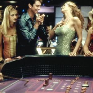 Even though a sexy Vegas redhead (Amber Smith) rubs Michael's (Jerry O'Connell) dice for good luck, he still drums up a $51,000 casino debt