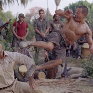 The Rock fights Ernie Reyes Jr. as Seann William Scott looks on.