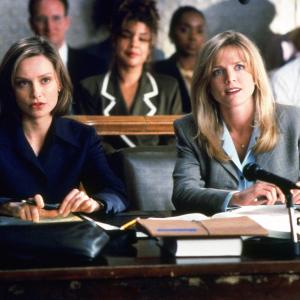 Still of Calista Flockhart and Courtney ThorneSmith in Ally McBeal 1997