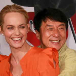 Jackie Chan and Amber Valletta at event of Kaimynas snipas 2010