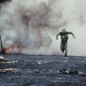 Burnett (OWEN WILSON) flees a calamitous domino effect of explosions triggered by pursuing enemy troops.