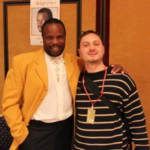 Grand L Bush greets James Bond fan Sebastien Coquelle in Birmingham England at Autographica the largest enterprise of its type in the world This event took place in October 2012