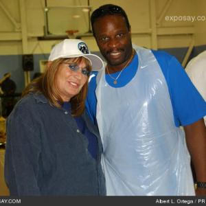 Grand L Bush and actordirector Penny Marshall pose for photos after helping the Mark Wahlberg Youth Foundation serve hundreds of needy families in Watts CA a hearty Thanksgiving dinner with all the trimmings