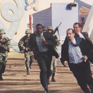 Grand L. Bush, John Storey and Leon Rippy sprint the length of the Santa Monica Pier in a scene from THE VISITOR. There were more than six exhaustive takes before the director finally yelled, 
