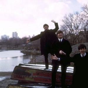 The Beatles ( Ringo Starr, John Lennon, Paul McCartney on top overturned boats)