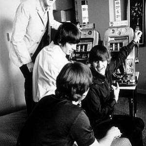 The Beatles  Paul McCartney George Harrison Ringo Starr John Lennon playing the slot machine