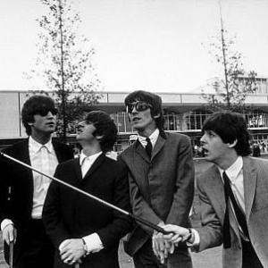 The Beatles John Lennon Ringo Starr George Harrison  Paul McCartney in Indianapolis Paul points with a golf club