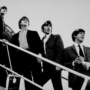 The Beatles Ringo Starr John Lennon George Harrison and Paul McCartney boarding a plane c 1965